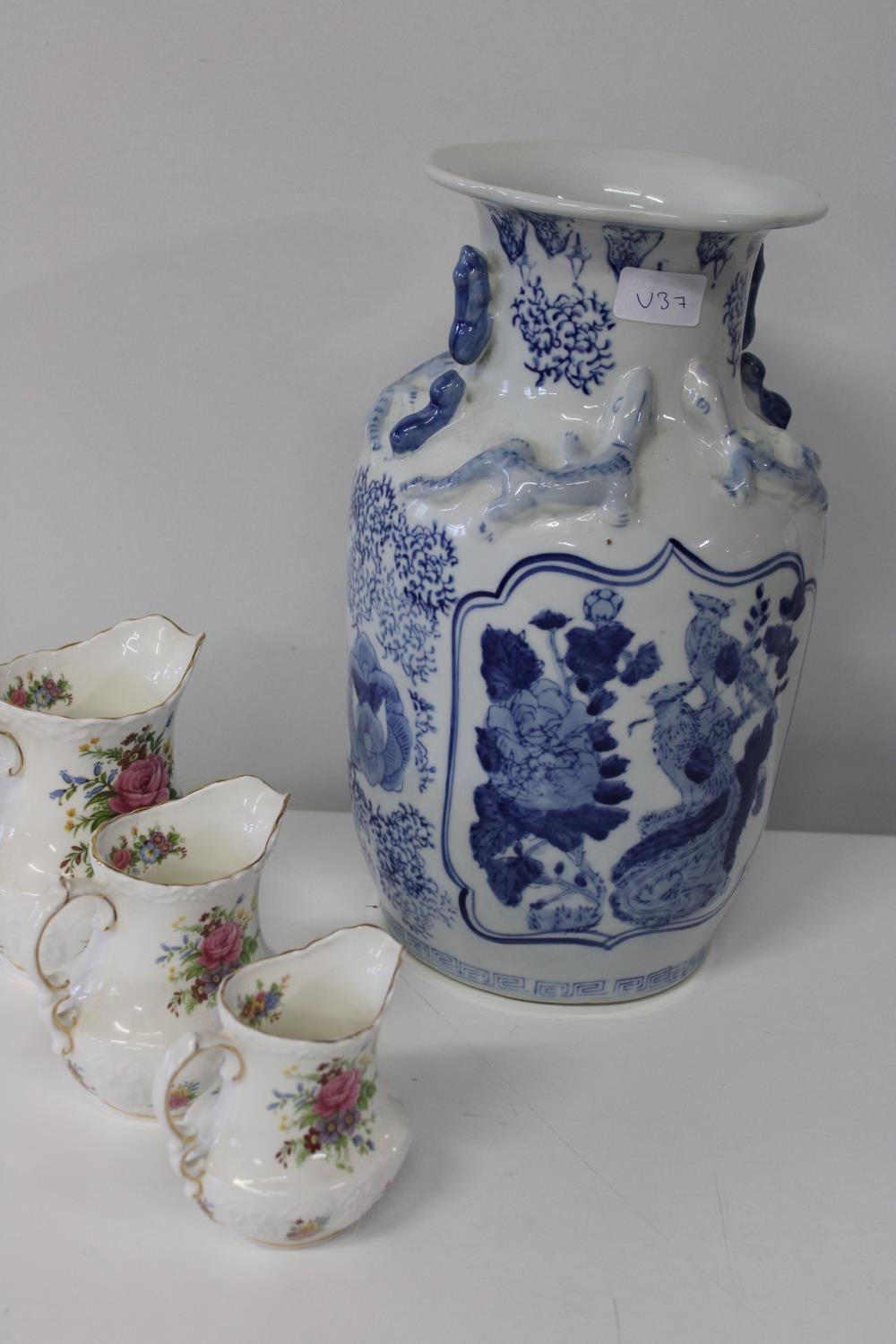 A large blue & white Oriental vase & three pieces of Modus bone china. vase 37cm h