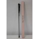 A boxed Agent Provocateur riding crop.