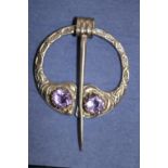 A hallmarked silver amethyst pemannular / kilt brooch by R. Allison