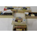Three boxed Corgi bus models