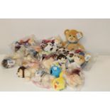 A box full of new children's soft toys etc