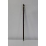 A vintage walking stick / snooker cue