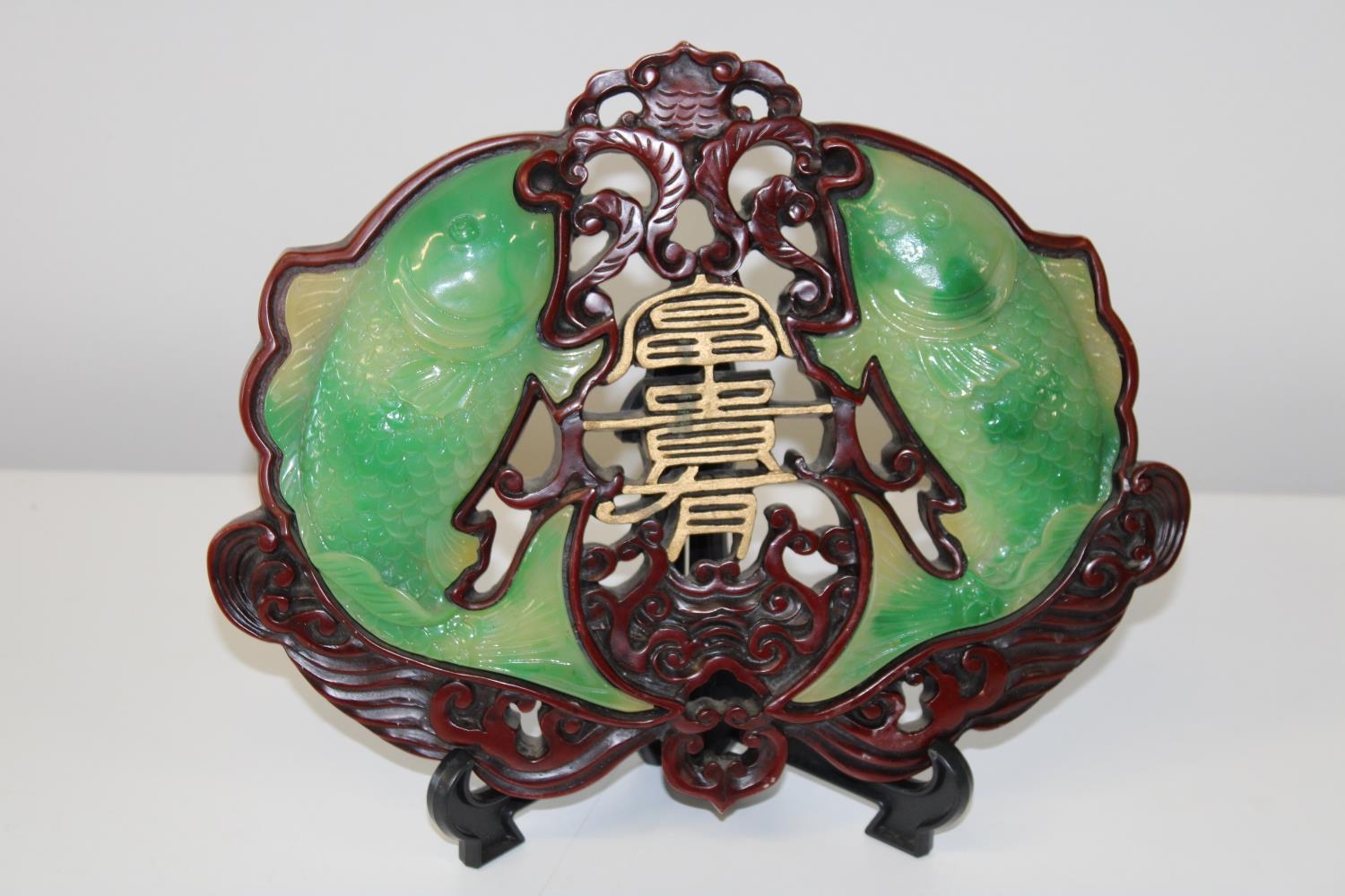 A Chinese carved fish plaque with green carp 30x24cm (sold as seen)