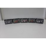 Five boxed F1 die-cast models