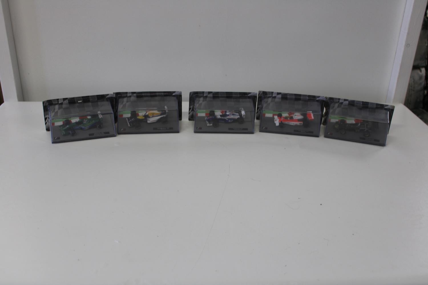 Five boxed F1 die-cast models