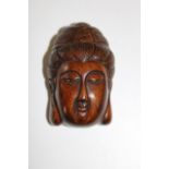 A carved boxwood netsuke