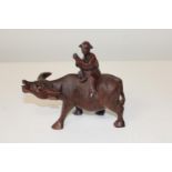 A finely carved Oriental wooden figure of water buffalo & man. 18cm x 16cm
