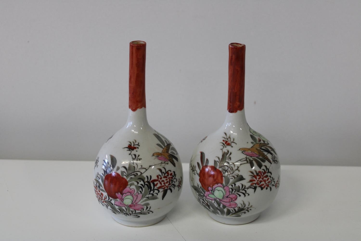 A pair of hand painted gourd shaped vases with bird & flower decoration. h 20cm