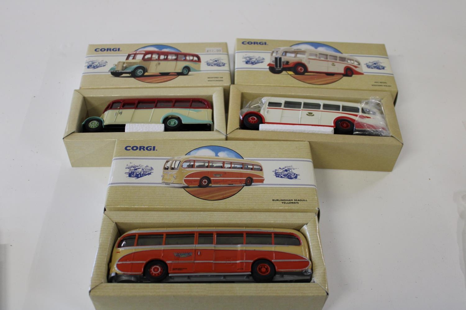 Three boxed Corgi bus models