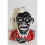 A vintage jolly man money box