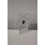 A Waterford Crystal paperweight in the form of a harp