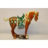 A large ceramic Chinese Tang horse with character marks to the base ( tail has been off & re-glued).