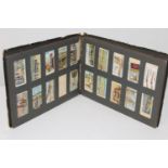 A Gallaher cigarette card album contain Great War series cards