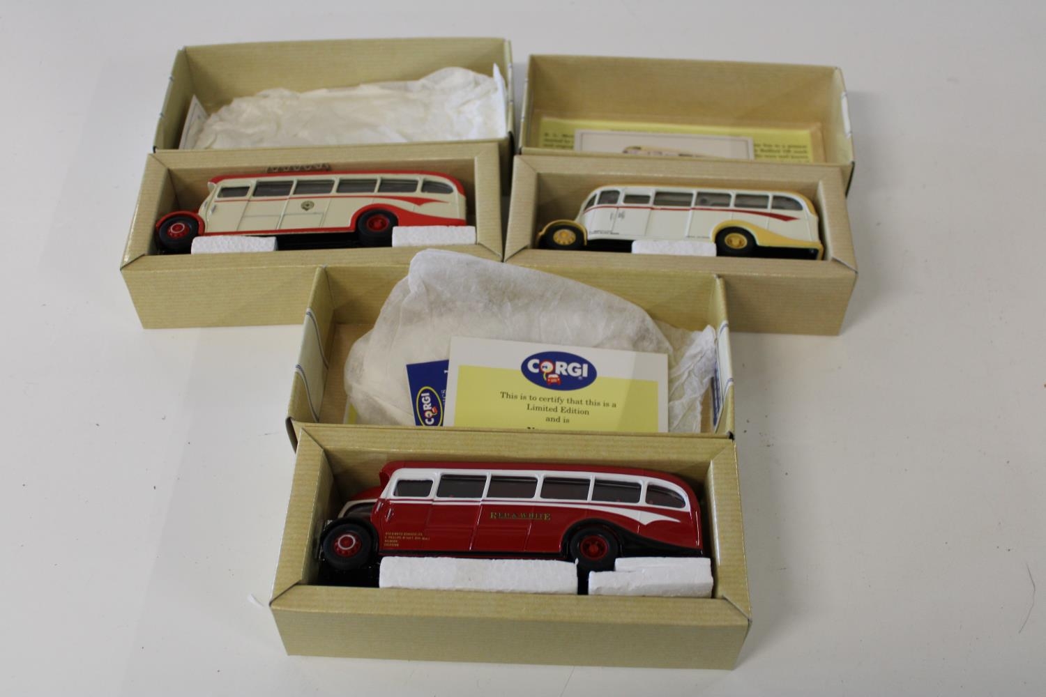 Three boxed Corgi bus models