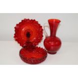 Three stylish pieces of vintage red glass ware. Jug id 25cm tall