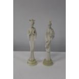 Two Oriental lady figures. 26cm tall