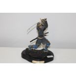 A vintage Samuri sculpture. 27cm tall