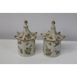 Two Oriental style pagoda lidded jars. 21cm tall