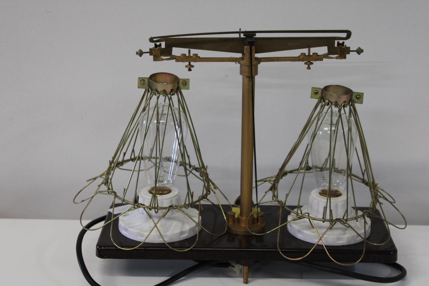 An unusual set of scales transformed into a table lamp in GWO