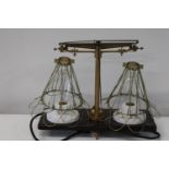 An unusual set of scales transformed into a table lamp in GWO
