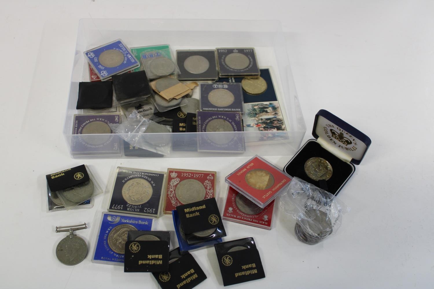 A large selection of assorted commemorative coins etc