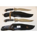 Two matching sheath knives with decorative Oriental blades