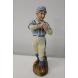 A Victorian bisque baseball figurine. 26cm tall