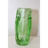 A small art glass green vase. 15cm tall