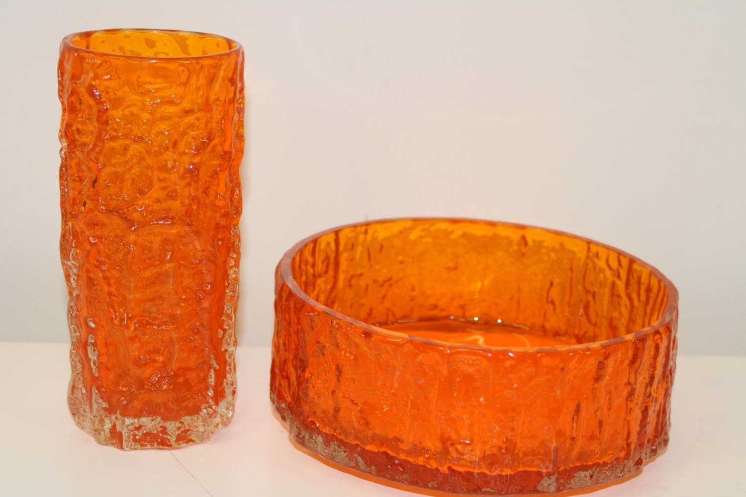 Two pieces of classic Whitefriars bark effect tangerine glass. Vase is 19cm tall & bowl is 20cm in