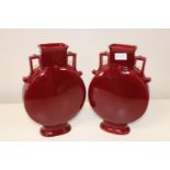 A pair of moon vases in a Red Glaze. 34cm tall