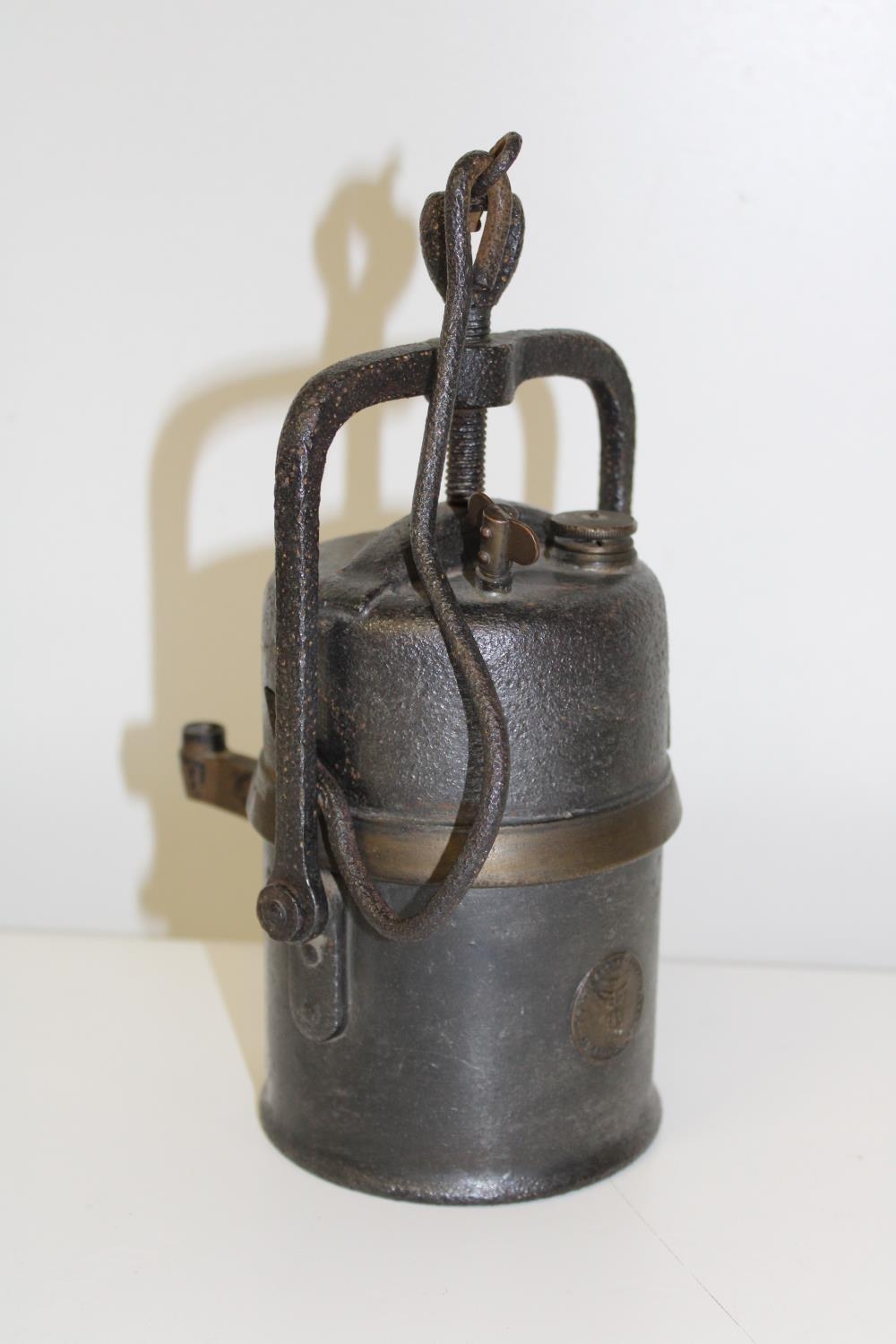 A vintage miners carbide lamp.