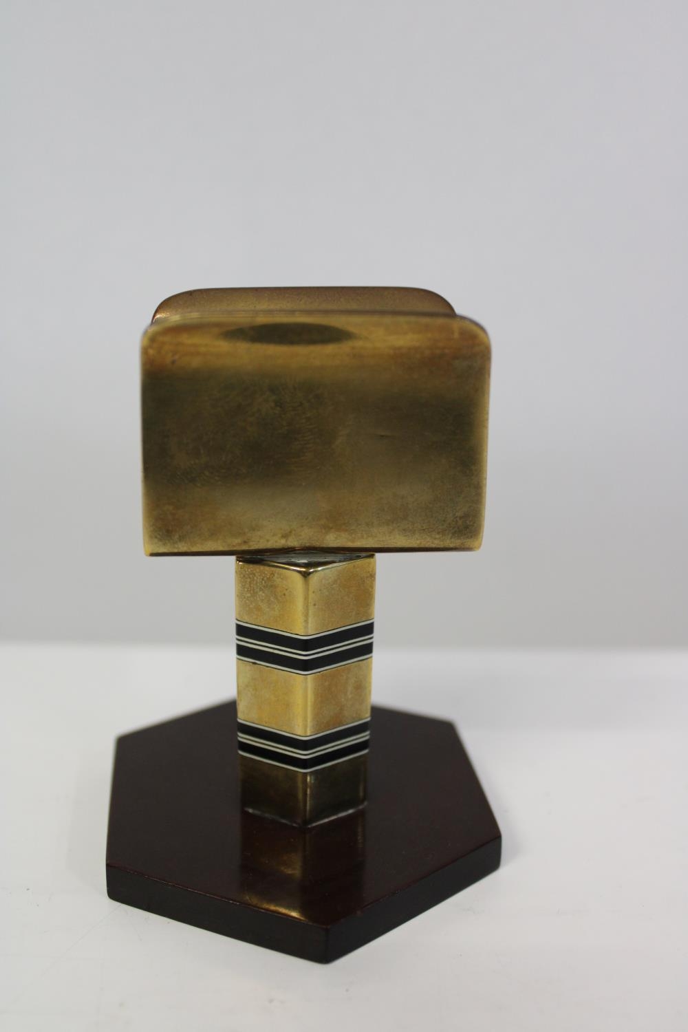 A Art Deco period brass & bakelite match box holder. 8cm tall