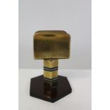 A Art Deco period brass & bakelite match box holder. 8cm tall