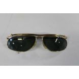 A pair of vintage gold framed Ray Ban sunglasses