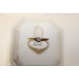 A 9ct gold & diamond solitaire ring size N 1/2