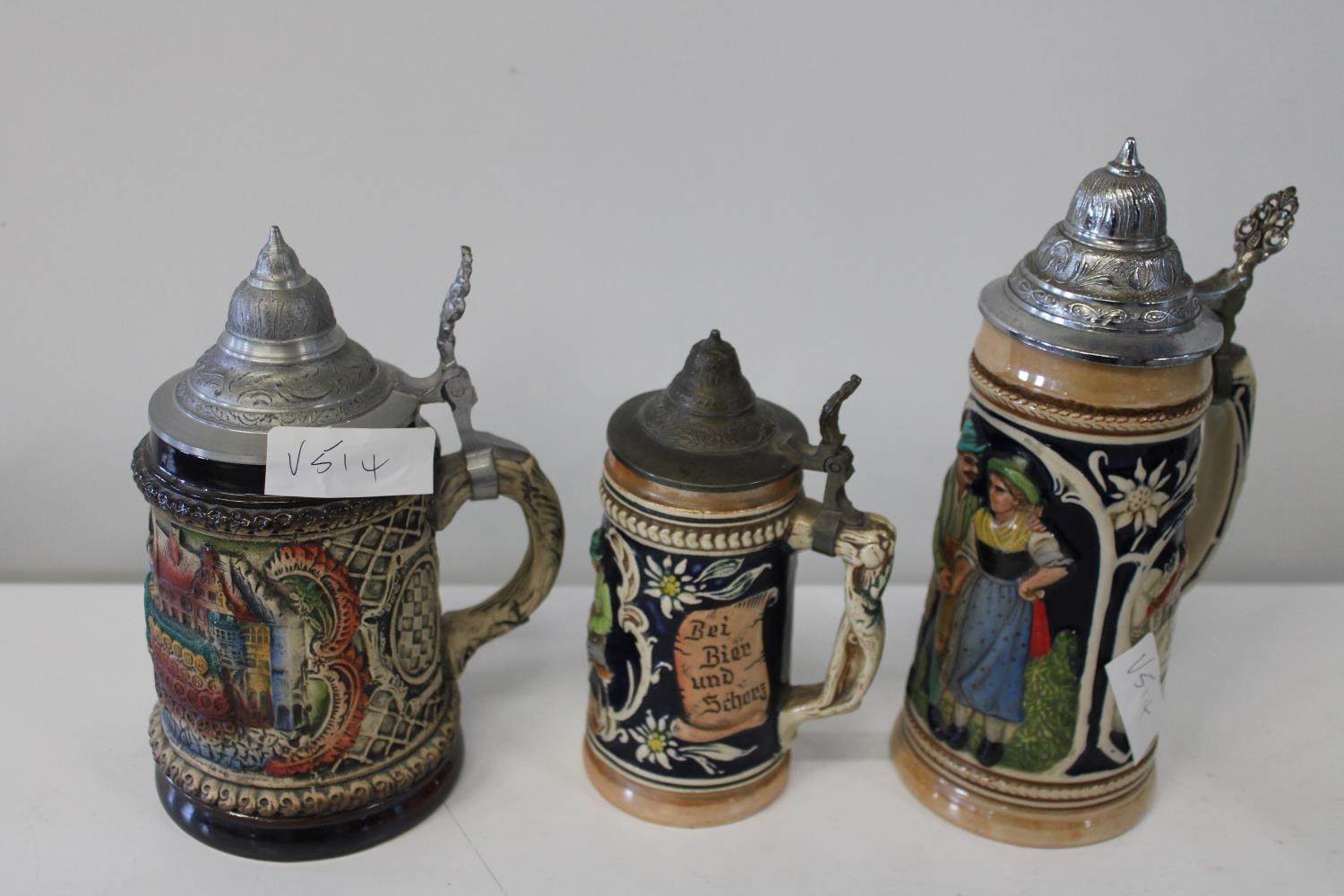 Three collectable German Steins. Tallest is 25cm tall