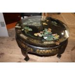 A Chinese coffee table with MOP inlay & bird & foilage decoration with a glass top. 48cm tall x 78cm