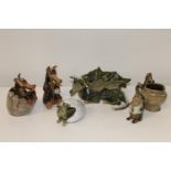 A selection of dragon related art pottery signed R H to the base