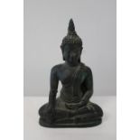 A small bronze Buddha. 10cm tall