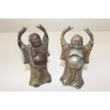 A pair of cast metal Buddhas