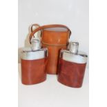 A pair of cased hip flasks