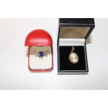 A gold on silver blue stone ring & 9ct gold cameo pendant