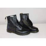 A new pair of men's black boots size 9