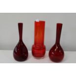 Three pieces of stylish red art glass. Height 25cm