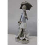 A Lladro figurine. Height 27cm A/F