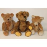 A wicker basket & three vintage teddy bears