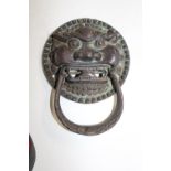 A Chinese bronze door knocker