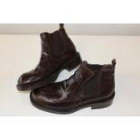 A pair of new Shelly's brown leather boots size 10