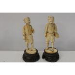A pair of antique ivory carved figures 15cm tall without stand