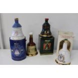 Four Wade empty Bell decanters
